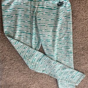 Nike Aqua and White Wave Leggings. 56% cotton 33% polyester 11% spandex
